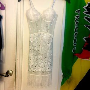 white Mini Dress decorated with stylish embellishments.